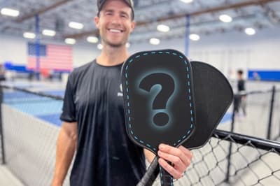Brandon holding an unspecified pickleball paddle